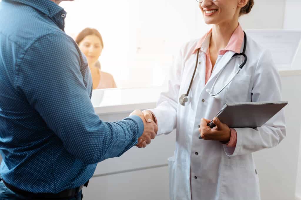 Doctor and patient shaking hands